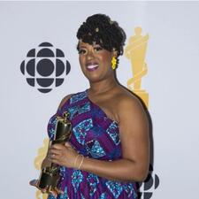 Raquel McIntosh poses for photos after winning the Teacher of the Year Award during the 2026 Juno Awards in Hamilton.